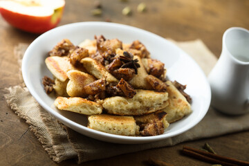 Traditional Austrian pancake dessert with apple and raisins