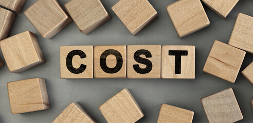 cost - word concept from wooden blocks. Top view