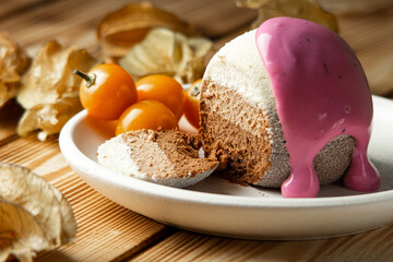 chocolate cake with physalis and blueberry yogurt