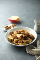 Traditional Austrian pancake dessert with apple and raisins