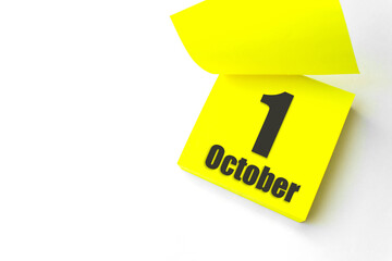 October 1st . Day 1 of month, Calendar date. Close-Up Blank Yellow paper reminder sticky note on White Background. Autumn month, day of the year concept.
