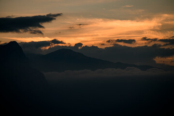 gorgeous view of sea, coastline, mountains and sky at sunset