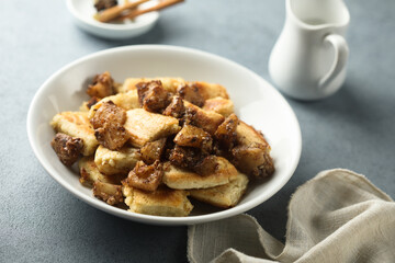 Traditional Austrian pancake dessert with apple and raisins