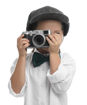 Cute little detective taking photo with vintage camera on white background