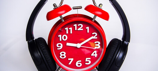 Retro alarm clock and headphone with white background