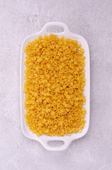 Dry pasta in a ceramic dish