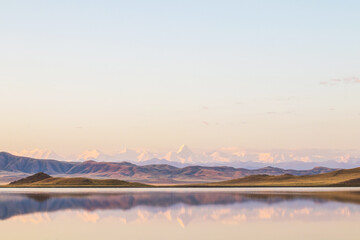 Lake Tuzkol in Kazakhstan and a view of Khan Tengri peak at sunrise