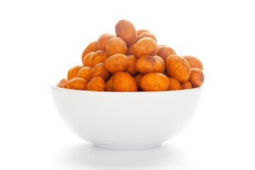 Crunchy Peanut in a white Ceramic  bowl, made with besan coated peanuts. Pile of Indian spicy snacks (Namkeen), under backlight, Front view, against the white background.