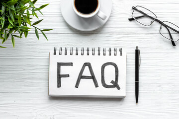 FAQ - fequently asked question - on table ofiice table. Top view