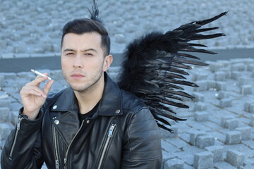 Attractive angel smoking a cigarette 