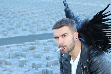 Attractive angel smoking a cigarette