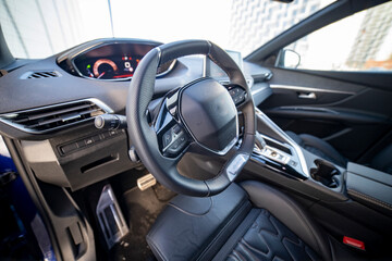 driver's seat and steering wheel of a modern fashionable car