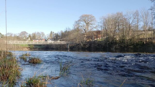 Fast water on the Water of Ken in winter, a Scottish River at Dalry, in Galloway, Scotland