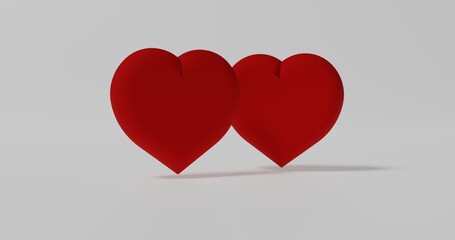 Two nicely shaped 3D red hearts with shadows on white, 3D rendering