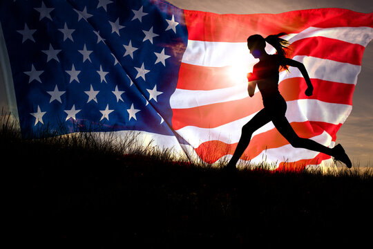 Young  woman silhouette  running over united states  waving flag
