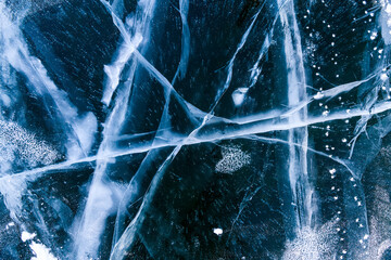 Blue ice of Lake Baikal. Ice texture with abstract cracks. 