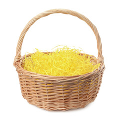 Wicker basket with yellow filler isolated on white. Easter item