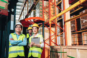 Working Team at warehouse. Manager use Tablet Information to further placement in storage department and asian woman warehouse workers.background driver at Warehouse forklift loader works with goods