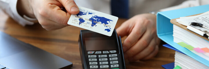 Man applies card to terminal. Online Shopping Worldwide about concept