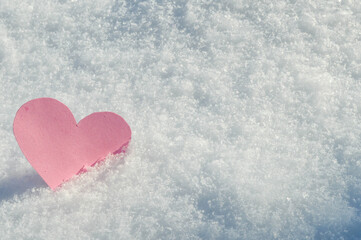 Pink Hearts for Valentine's Day on white snowy background, love concept, copyspace