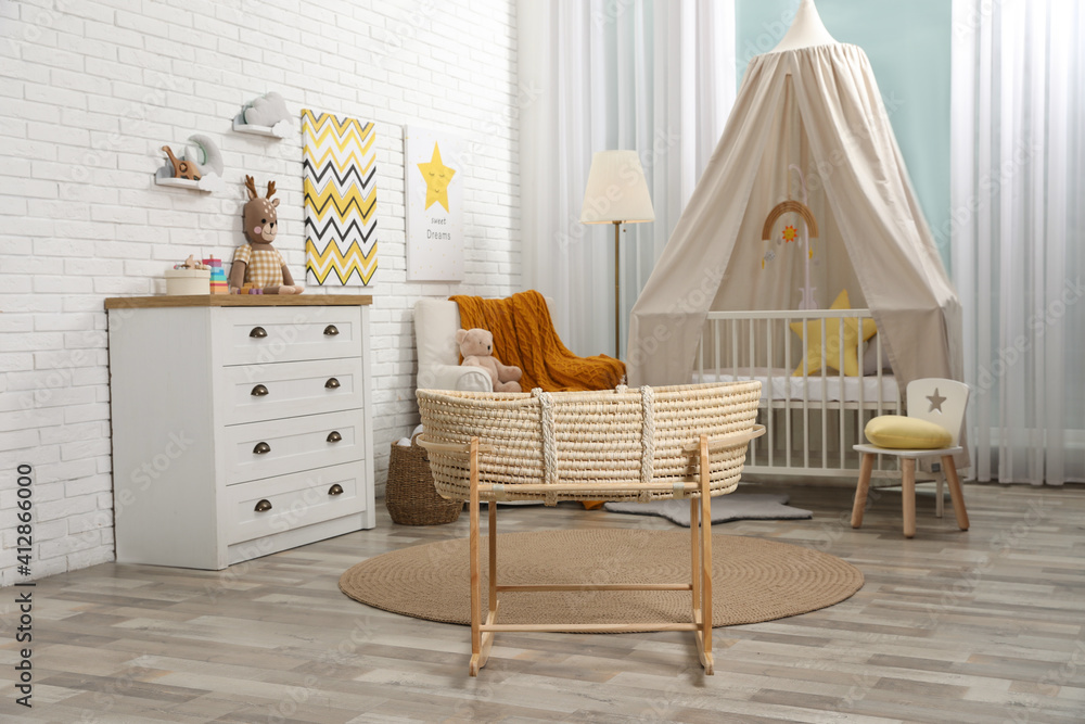 Wall mural Stylish baby's room with comfortable cot. Interior design