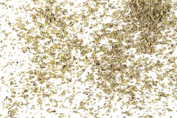 Dried oregano leaves spice pile isolated on white background, top view