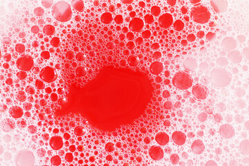 red background with foam and bubbles