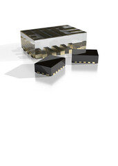 Close up of a microchip, chip, with black casing and gold terminals 