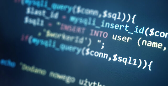 Colorful programming php and html code on a monitor. PHP language code closeup. Backend programming, software development concept