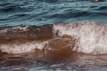 Breaking wave.Beautiful blue sea during the wind. Wave burst on the shore