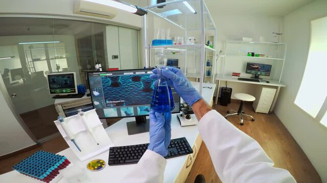 POV of medical scientist working with DNA scan image in modern equipped lab holding test tube with sample. Team examining vaccine evolution using high tech and chemistry tools for vaccine development