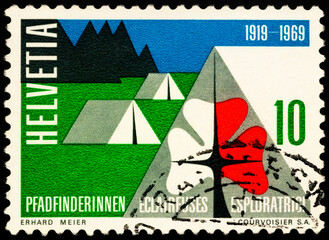 Tent camp and scout badge