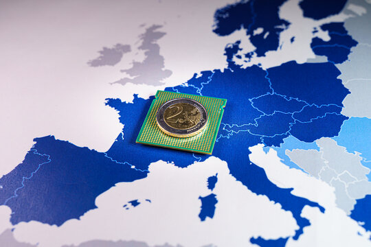 2 euro coin over a CPU on an European Union map, symbolizing the Digital Euro. European and the national central banks of the euro area are exploring the benefits and risks of a digital coin.