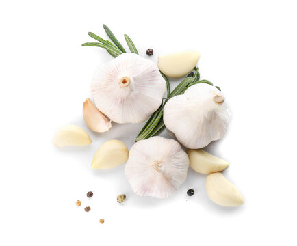 Fresh garlic with spices on white background