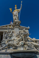 Fototapeta na wymiar Pallas Athena fountain with 5 m tall statue of the Goddess of Wisdom (Pallas-Athene-Brunnen, 1898), in front of Austrian Parliament. Vienna, Austria, Europe.