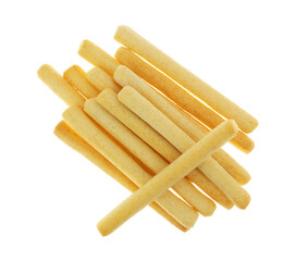 Overhead view of a group of crunchy breadsticks with one at an angle isolated on a white background.