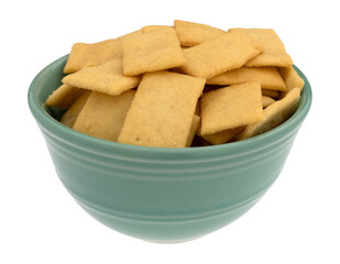 Cheese and garlic snack crackers in a green bowl isolated on a white background side.view.