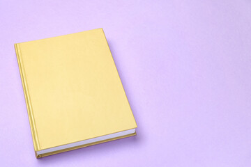 Blank book on color background