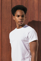 Portrait of a young black skinned man with afro hair