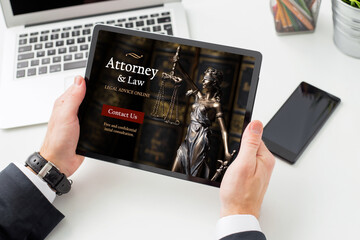 Man seeking legal advice online from law attorney
