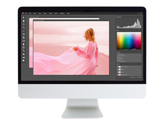 Editing and retouching photo on  desktop computer
