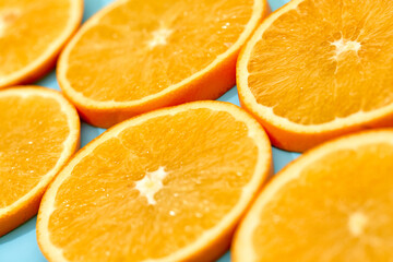 ripe orange fruit on blue background. Sliced orange background