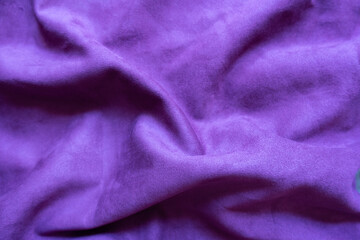 Violet faux suede fabric in soft folds