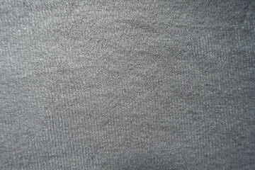 Fototapeta na wymiar Surface of simple gray cotton jersey fabric