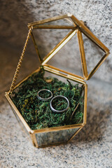 Wedding rings on a golden box