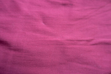 Close shot of jammed reddish rose viscose fabric