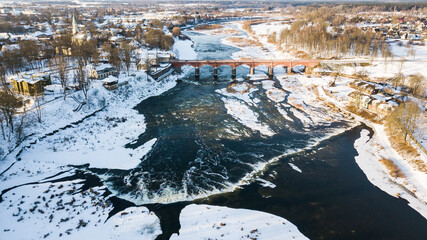 Venta Rapid waterfall, the widest waterfall in Europe and long brick bridge, Kuldiga, Latvia. Captured from above.