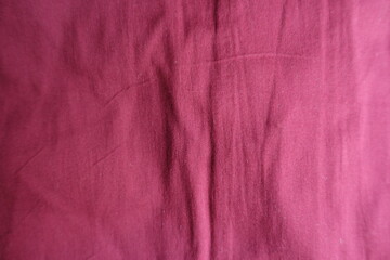 View of jammed reddish rose viscose fabric from above
