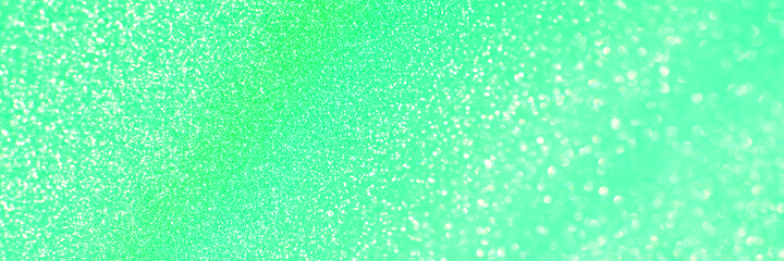 Green glitter bokeh circle glow blurred and blur abstract. Glittering shimmer bright luxury . White and silver glisten twinkle for texture wallpaper and background backdrop.
