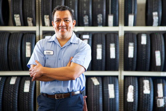 Portrait of Hispanic male owner in auto repair shop